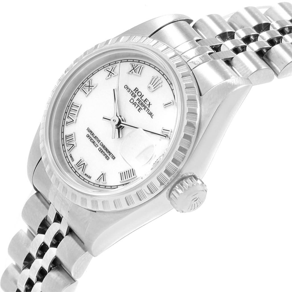 This image shows a side angle of a Rolex Date 79240 Women's Stainless Steel White Dial 79240 Women's Stainless Steel White Dial model watch, highlighting the face, bezel, crown, and bracelet.