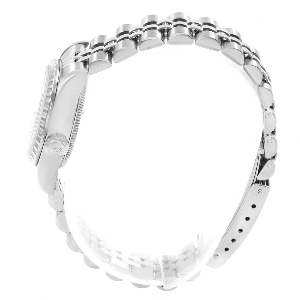 The image shows a side view of the Rolex Date 79240 Women's Stainless Steel White Dial 79240 Women's Stainless Steel White Dial model watch, focusing on the case and partially on the bracelet.