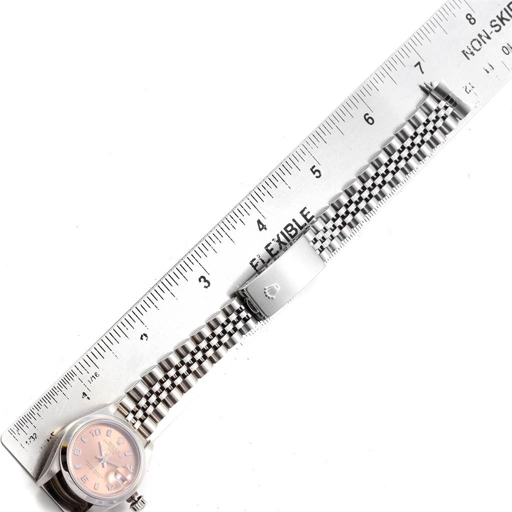 The image shows a Rolex Date 79160 Women's Stainless Steel Pink Dial 79160 Women's Stainless Steel Pink Dial watch from a top-down angle, displaying the face, band, clasp, and part of a ruler.