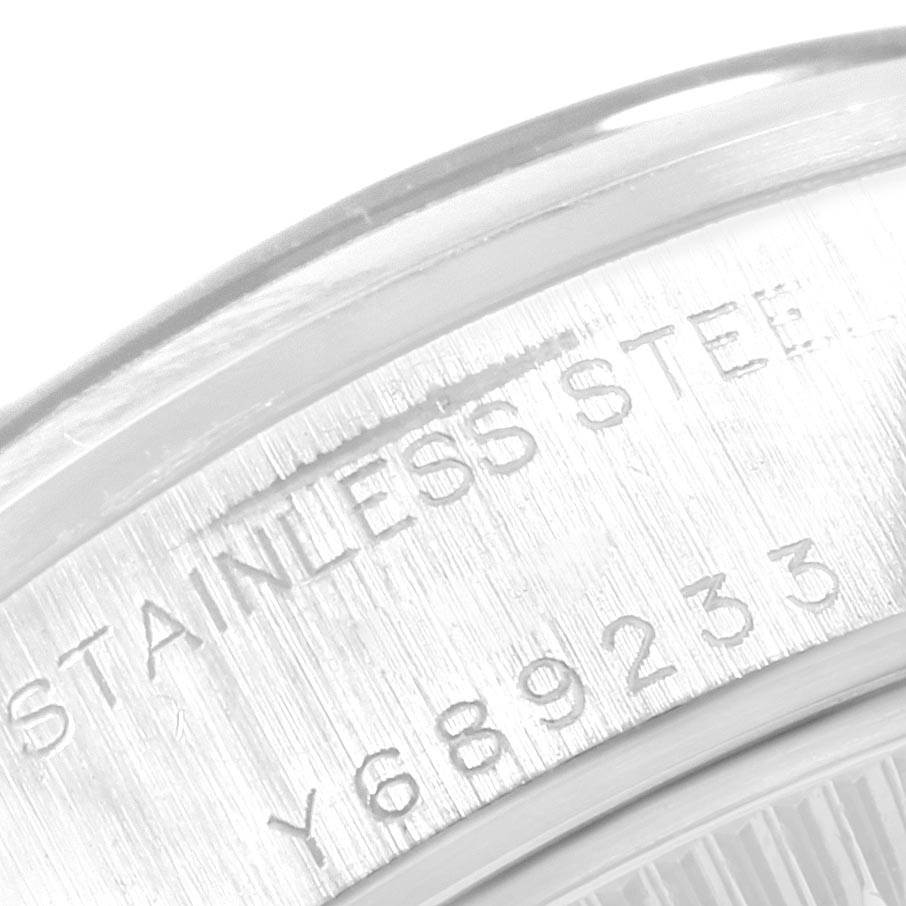 This image shows a close-up of the stainless steel case back with reference numbers for a Rolex Date 79160 Women's Stainless Steel Pink Dial 79160 Women's Stainless Steel Pink Dial model watch.