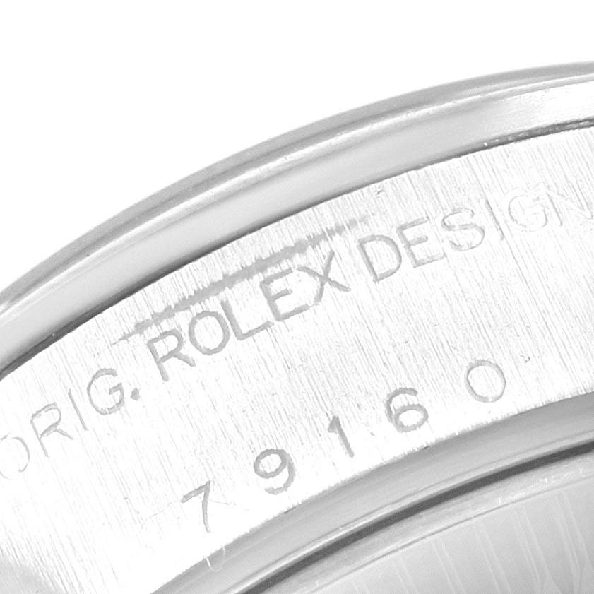 Close-up of the serial number and "ROLEX DESIGN" engraving on the case back of a Rolex Date 79160 Women's Stainless Steel Pink Dial 79160 Women's Stainless Steel Pink Dial watch.