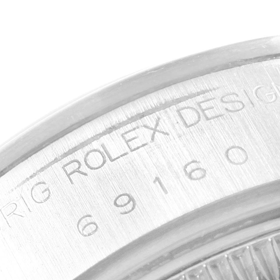 This image shows a close-up of the serial number and branding on the casing of a Rolex Date 69160 Women's Stainless Steel Silver Dial 69160 Women's Stainless Steel Silver Dial watch.