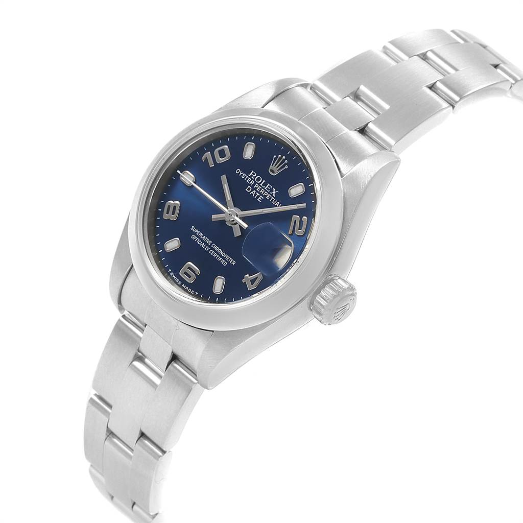 The image shows a Rolex Date 69160 Women's Stainless Steel Blue Dial 69160 Women's Stainless Steel Blue Dial model watch at an oblique angle, highlighting its blue dial, date window, and metal bracelet.