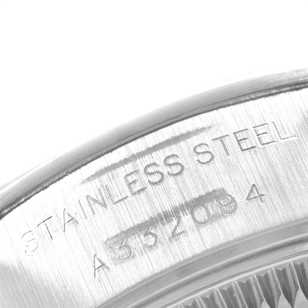 The image shows a close-up of the stainless steel case back with engravings on a Rolex Date 69160 Women's Stainless Steel Blue Dial 69160 Women's Stainless Steel Blue Dial model watch.