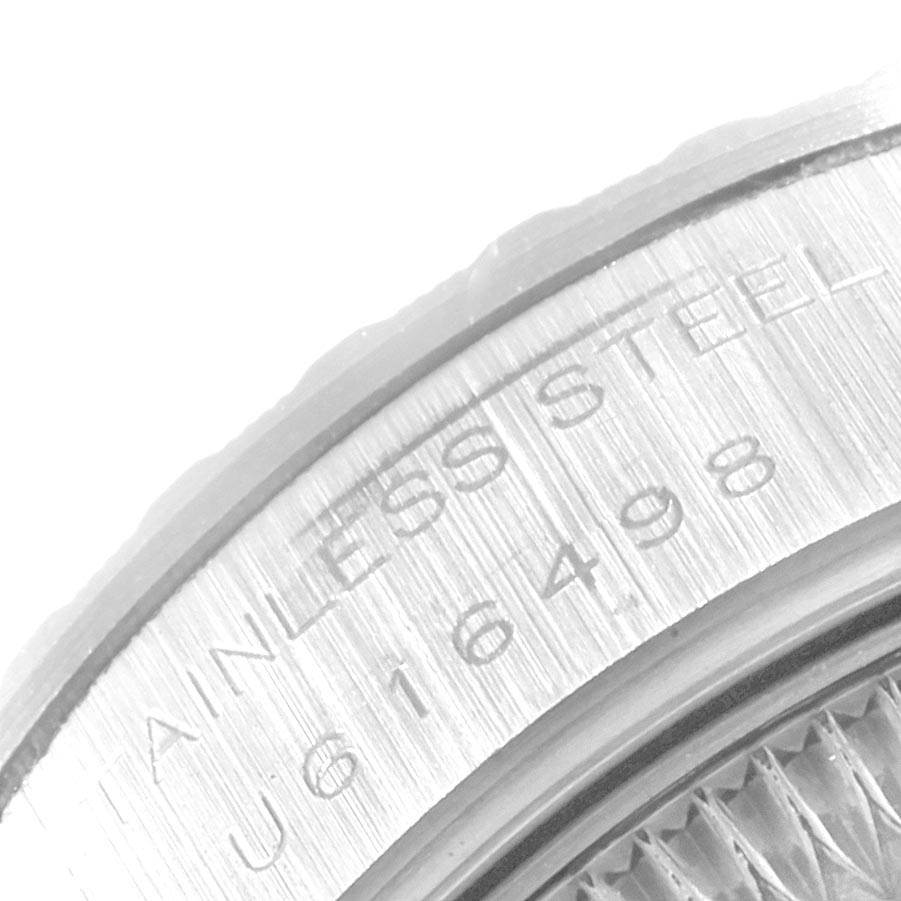 This close-up image shows the engraved stainless steel case back of a Rolex Date 69240 Women's Stainless Steel Silver Dial 69240 Women's Stainless Steel Silver Dial model watch.