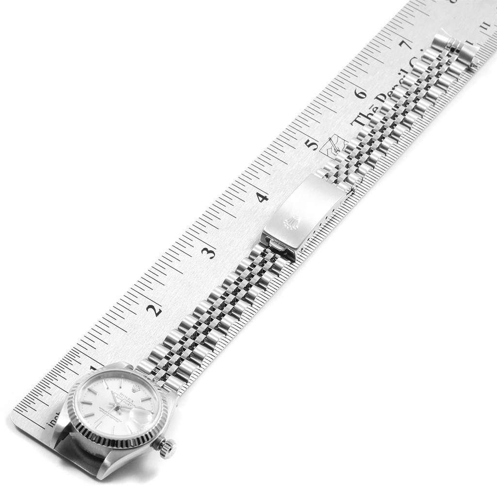 The image shows a Rolex Date 79174 Women's Stainless Steel Silver Dial 79174 Women's Stainless Steel Silver Dial model watch face and bracelet, measured against a ruler, displayed flat from a top-down angle.