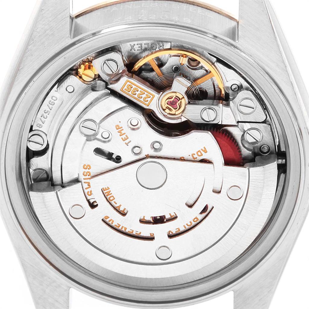 The image shows the intricate internal mechanism of a Rolex Date 79174 Women's Stainless Steel Silver Dial 79174 Women's Stainless Steel Silver Dial model watch from a back angle.