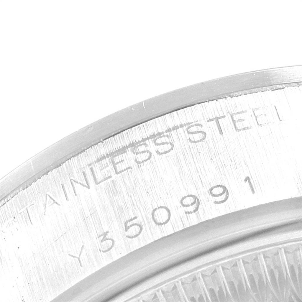 The image shows a close-up of the stainless steel case back with engraving for the Rolex Date 79160 Women's Stainless Steel Blue Dial 79160 Women's Stainless Steel Blue Dial model watch.