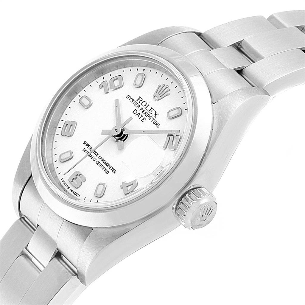 The image shows a Rolex Oyster Perpetual Date watch at a side angle, highlighting the dial, crown, and part of the bracelet.