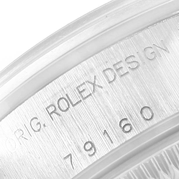 The image shows the serial and model number engraving on the case side of a Rolex Date 79160 Women's Stainless Steel White Dial 79160 Women's Stainless Steel White Dial watch.