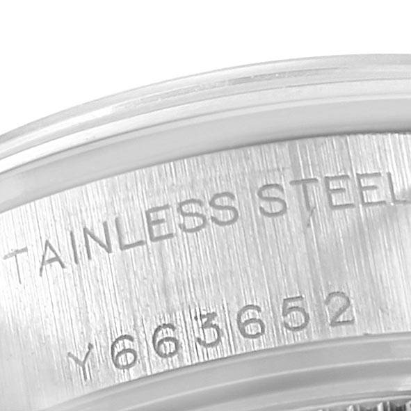 The image shows a close-up of the serial number engraving on the stainless steel casing of the Rolex Date 79160 Women's Stainless Steel White Dial 79160 Women's Stainless Steel White Dial watch.