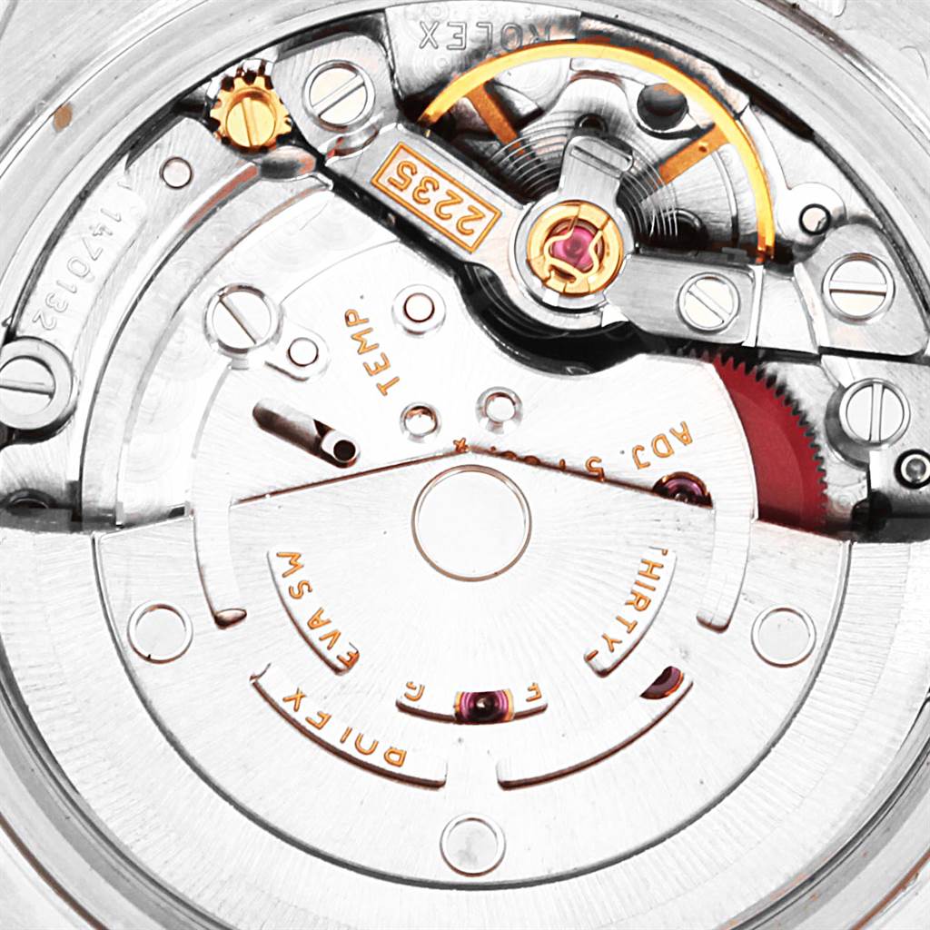 This close-up image of a Rolex Date 79160 Women's Stainless Steel White Dial 79160 Women's Stainless Steel White Dial model shows the intricate internal mechanism of the watch's movement.