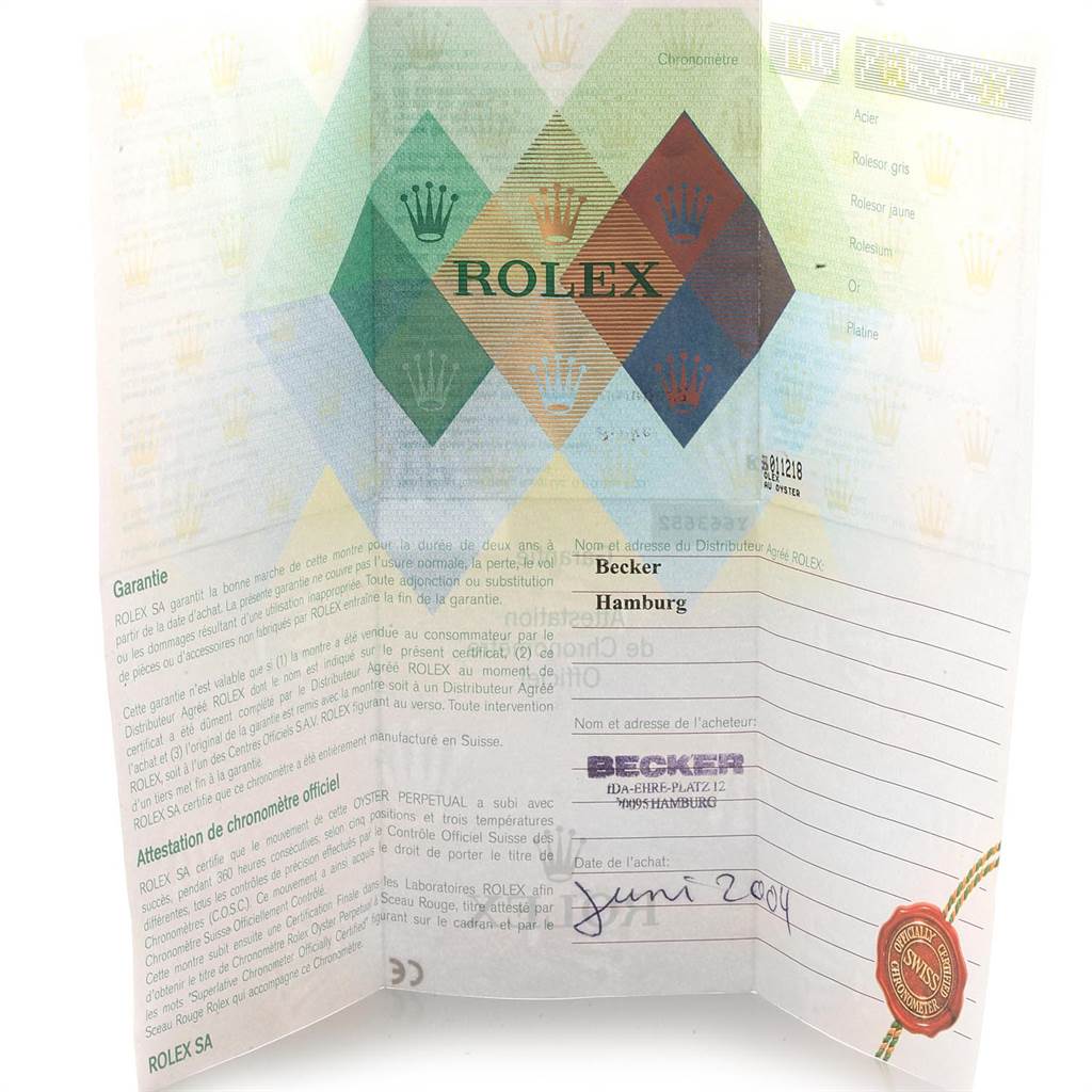 The image shows an open Rolex warranty certificate for the Date model, showing details of the distributor and purchase information.