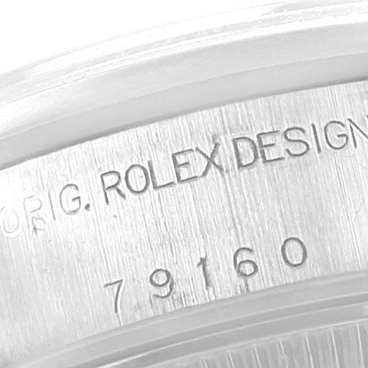 This close-up image shows the model and serial number engraving on the side of a Rolex Date 79160 Women's Stainless Steel White Dial 79160 Women's Stainless Steel White Dial watch.