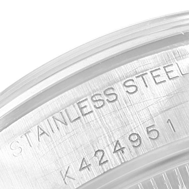 This close-up image shows the engraved serial number and "Stainless Steel" text on the casing of a Rolex Date 79160 Women's Stainless Steel Pink Dial 79160 Women's Stainless Steel Pink Dial model watch.