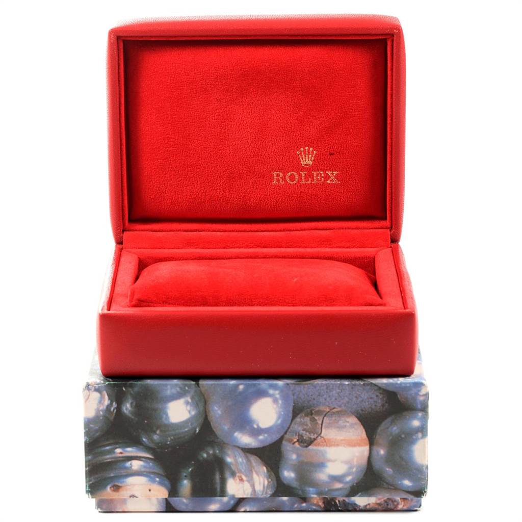 This image shows an open red box for a Rolex Date 69240 Women's Stainless Steel White Dial 69240 Women's Stainless Steel White Dial model watch, revealing the cushion inside.