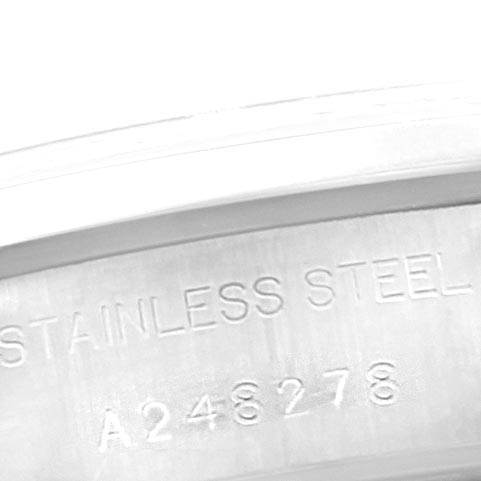 The image shows a close-up of the inner casing with the serial number and "STAINLESS STEEL" engraving on a Rolex Date 79160 Women
s Stainless Steel Blue Dial 79160 Women
s Stainless Steel Blue Dial model watch.