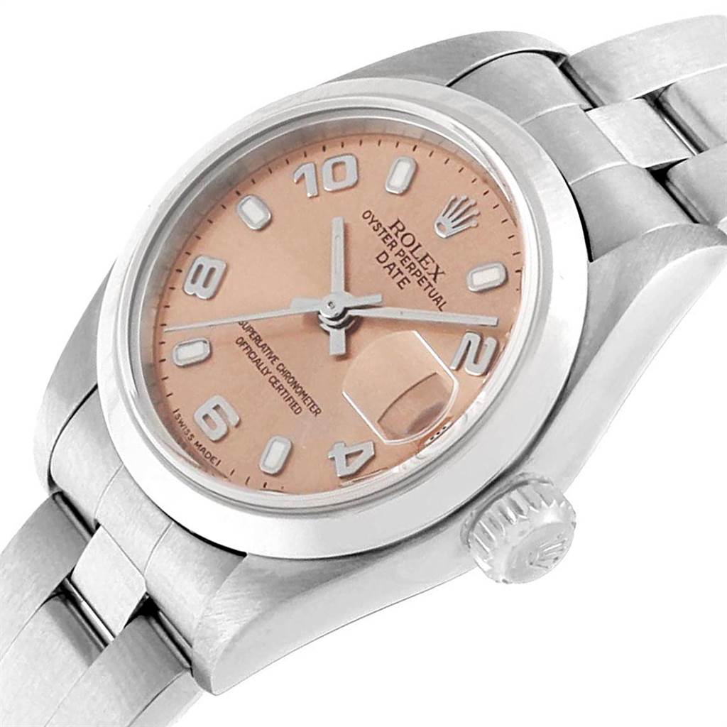 The image shows a Rolex Oyster Perpetual Date watch at an oblique angle, highlighting the face, crown, and part of the bracelet.