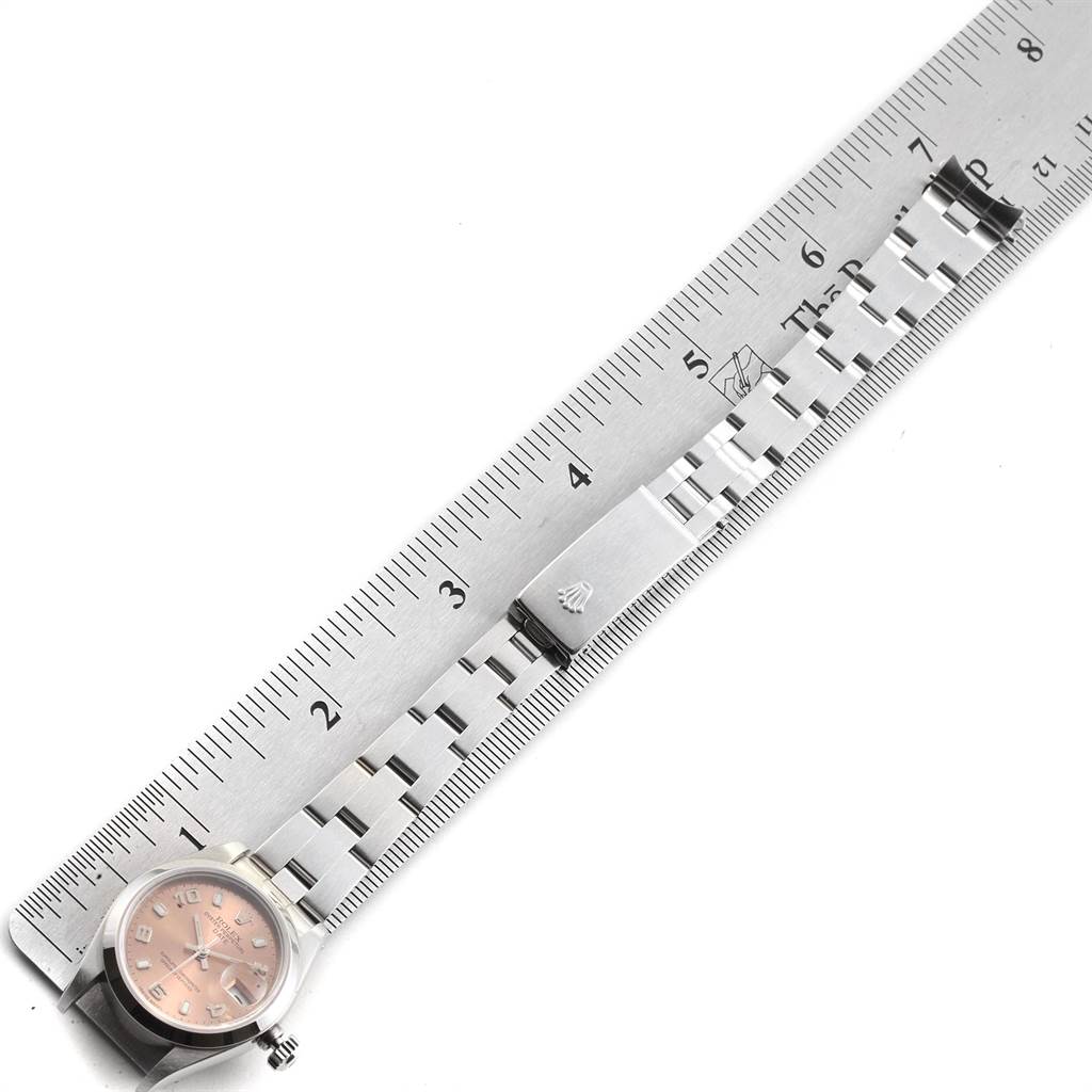 This image shows a Rolex Date 79160 Women's Stainless Steel Pink Dial 79160 Women's Stainless Steel Pink Dial model watch featuring its dial, case, and bracelet measured against a ruler.