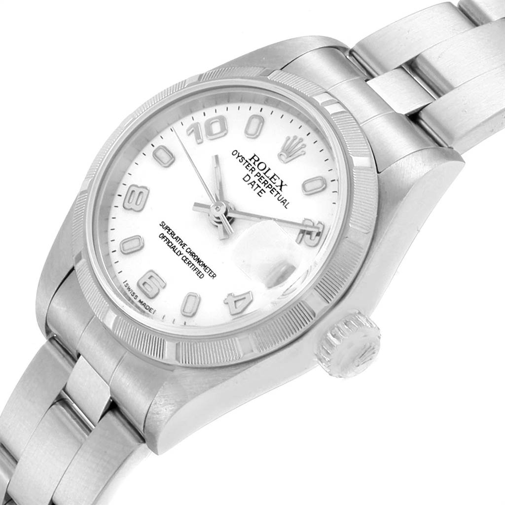 The image shows a Rolex Date 79190 Women's Stainless Steel White Dial 79190 Women's Stainless Steel White Dial model watch at an angle highlighting its dial, crown, bezel, and part of the strap.
