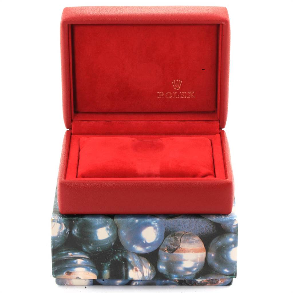 This image shows an open red Rolex watch box for the Date model, displaying the interior and the Rolex logo.
