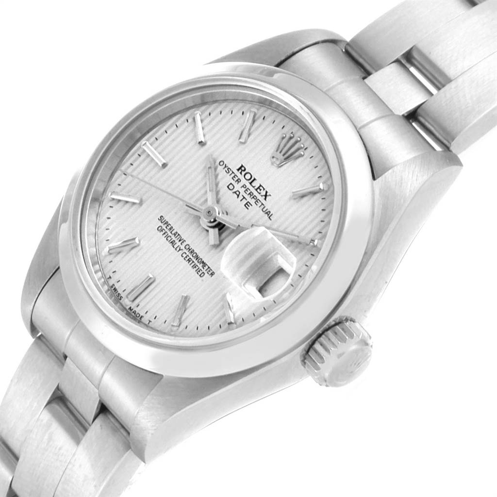 This image shows the face, crown, and part of the bracelet of a Rolex Date 69160 Women
s Stainless Steel Silver Dial 69160 Women
s Stainless Steel Silver Dial model watch at an angled view.