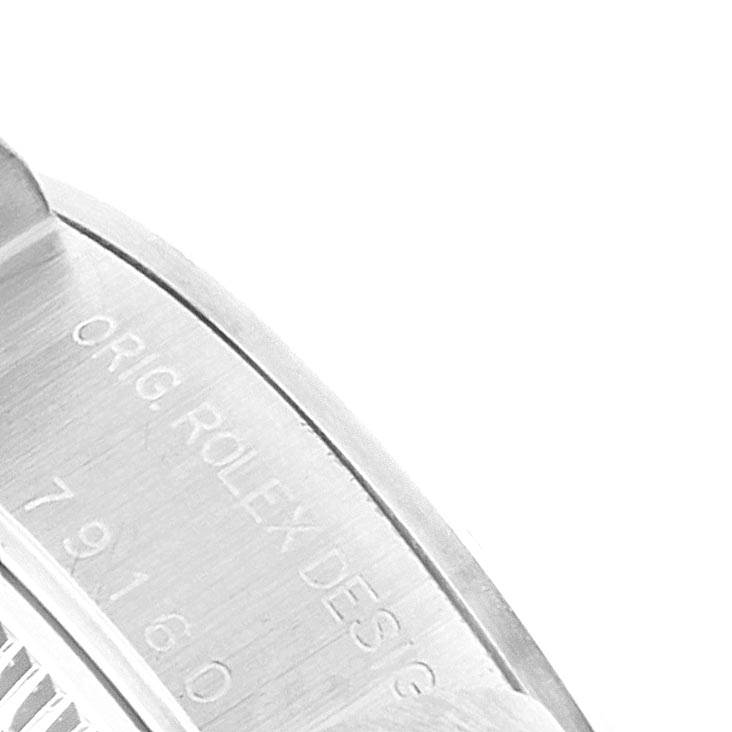 The image shows a close-up angle of the casing and serial number of a Rolex Date 79160 Women's Stainless Steel Pink Dial 79160 Women's Stainless Steel Pink Dial model watch.