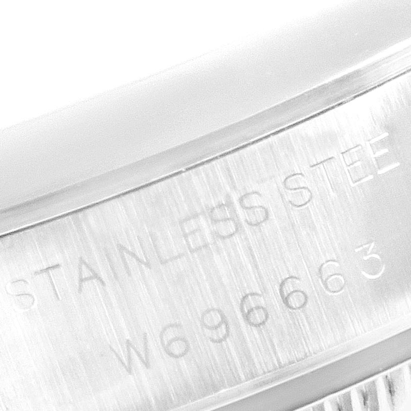 The image shows a close-up of the case part and engraved serial number of the Rolex Date 69160 Women
s Stainless Steel Blue Dial 69160 Women
s Stainless Steel Blue Dial model watch.