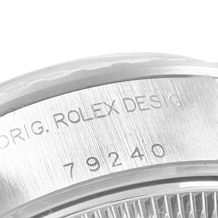 The image shows a close-up view of the case side of a Rolex Date 79240 Women's Stainless Steel Silver Dial 79240 Women's Stainless Steel Silver Dial model, featuring the "ROLEX DESIGN" and "79240" engraving.