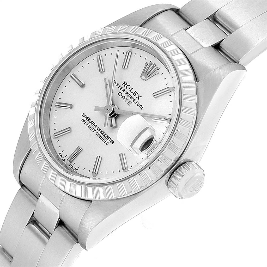 This image shows a side angle of a Rolex Date 79240 Women's Stainless Steel Silver Dial 79240 Women's Stainless Steel Silver Dial model watch, highlighting the dial, bezel, crown, and part of the bracelet.