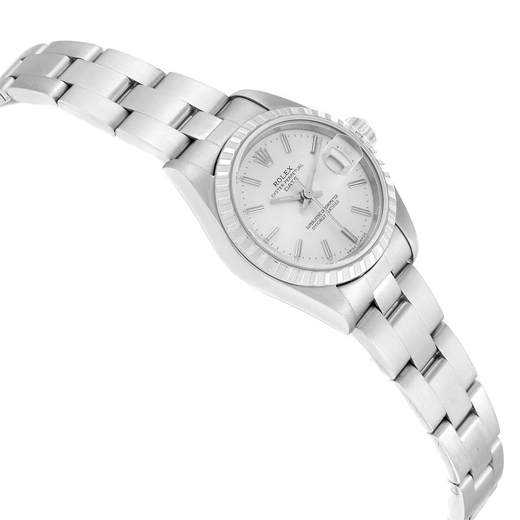 The image shows a side angle of a Rolex Date 79240 Women's Stainless Steel Silver Dial 79240 Women's Stainless Steel Silver Dial model watch, displaying its face, bracelet, and bezel.