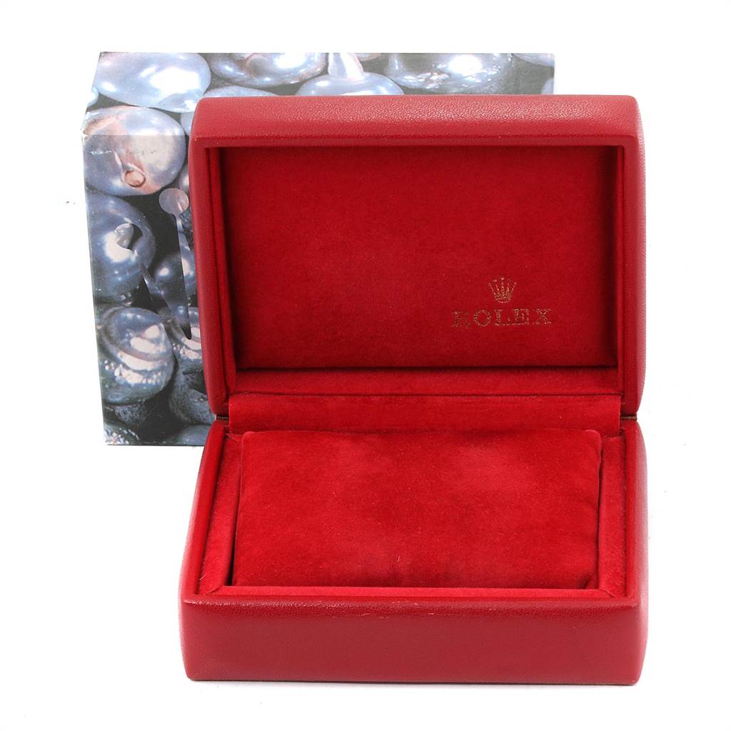 This image shows an empty, open Rolex watch box for the Date model, lined with red fabric.