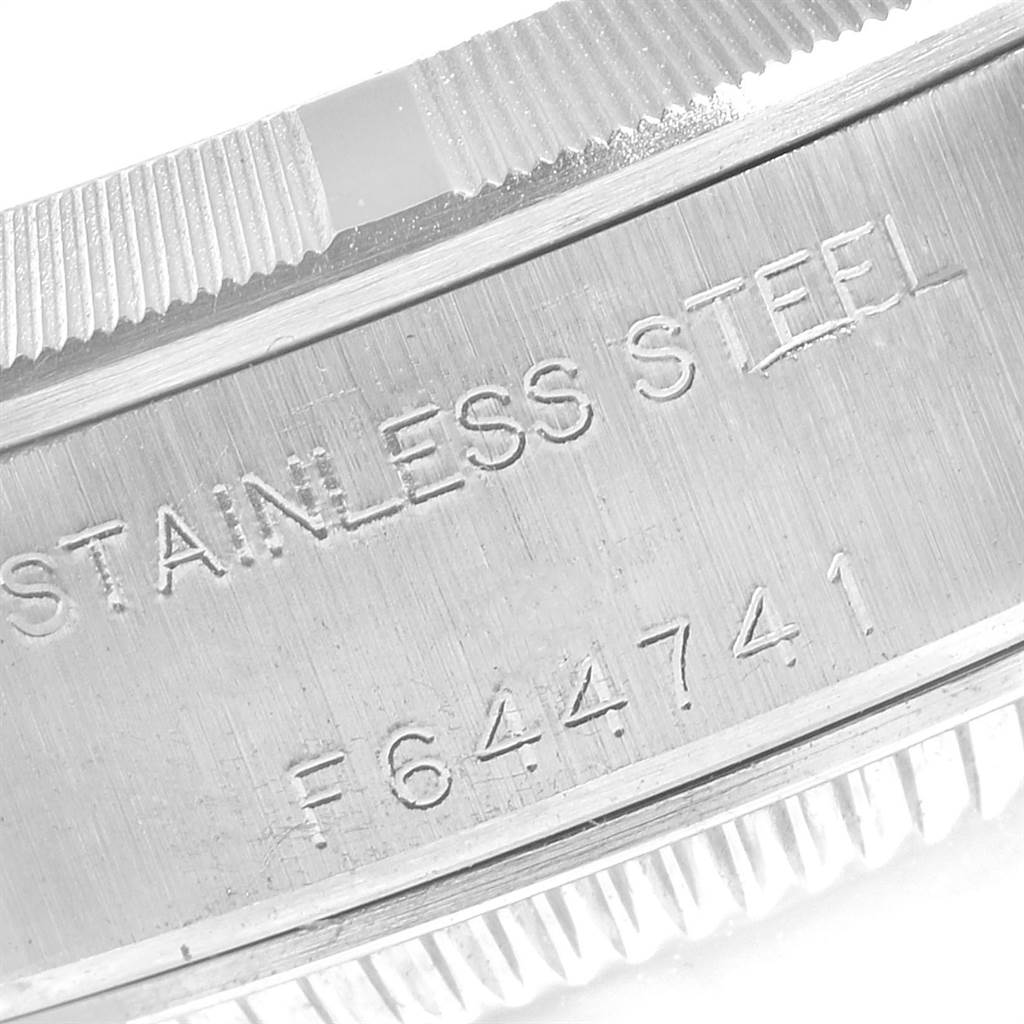 This image shows a close-up of the Rolex Date 79190 Women
s Stainless Steel Pink Dial 79190 Women
s Stainless Steel Pink Dial model
s stainless steel case with part of the fluted bezel visible.