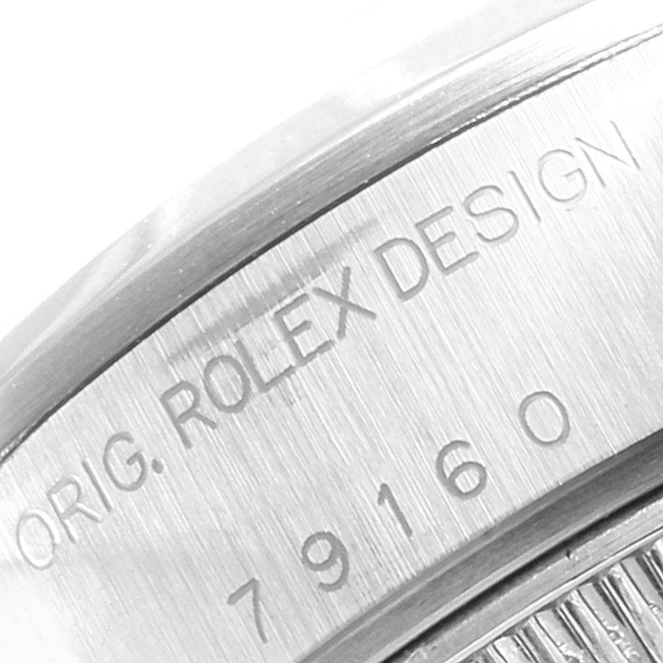 The image shows a partial close-up of the case with engraved text on a Rolex Date 79160 Women
s Stainless Steel White Dial 79160 Women
s Stainless Steel White Dial model watch.
