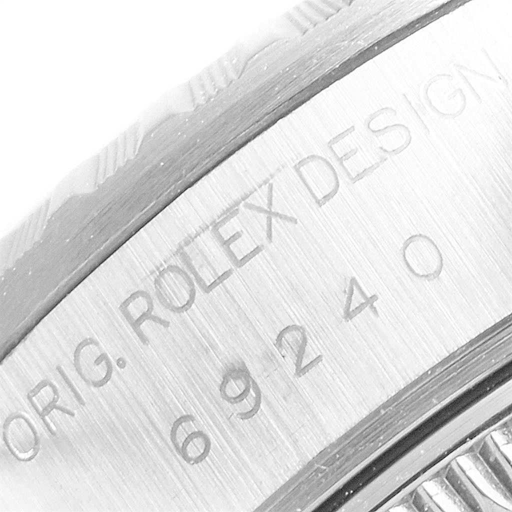 The image shows a close-up of the caseback and edge, featuring engravings of the Rolex Date 69240 Women's Stainless Steel White Dial 69240 Women's Stainless Steel White Dial model.