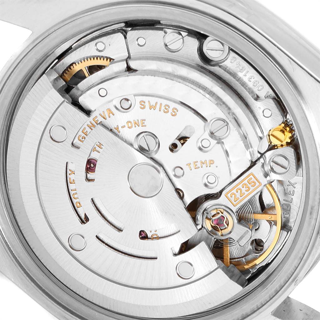 This is a close-up view of the Rolex Date 79190 Women
s Stainless Steel White Dial 79190 Women
s Stainless Steel White Dial model watch
s movement, showing gears and the 2235 engravings.