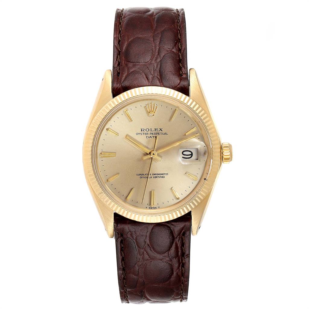 The Rolex Date 1503 Men's Yellow Gold Champagne Dial 1503 Men's Yellow Gold Champagne Dial watch is shown from a top-down angle, featuring its gold case, cream dial, magnified date window, and brown leather strap.