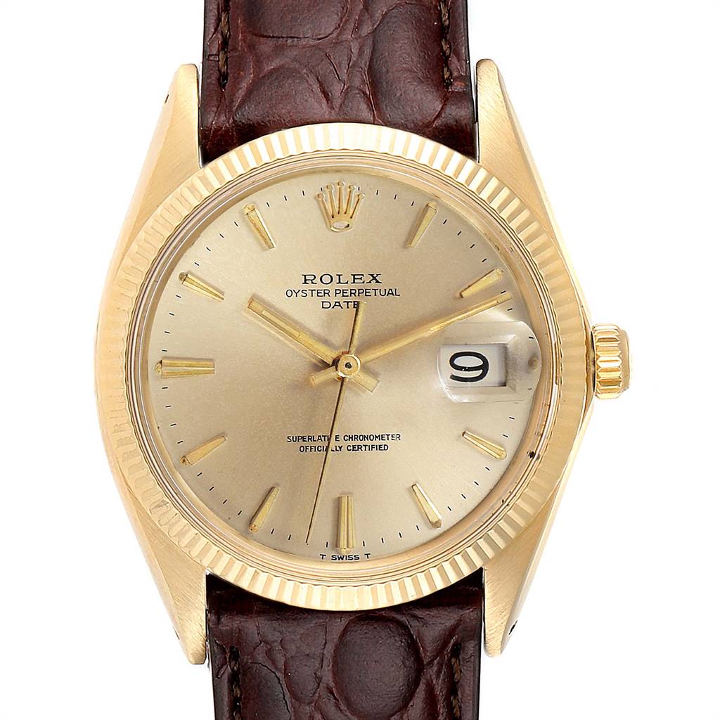 This is a close-up of a Rolex Date 1503 Men's Yellow Gold Champagne Dial 1503 Men's Yellow Gold Champagne Dial with a gold dial, gold case, date window, and brown leather strap.