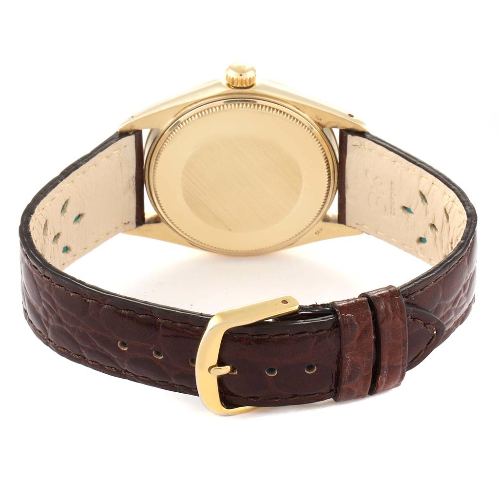 The image shows the back case and leather strap with a buckle of a Rolex Date 1503 Men's Yellow Gold Champagne Dial 1503 Men's Yellow Gold Champagne Dial model watch.