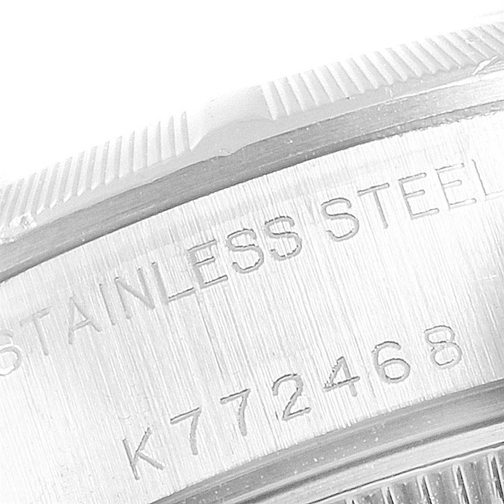 This image shows a close-up of the case back edge and engravings on a Rolex Date 79190 Women
s Stainless Steel Pink Dial 79190 Women
s Stainless Steel Pink Dial model watch.