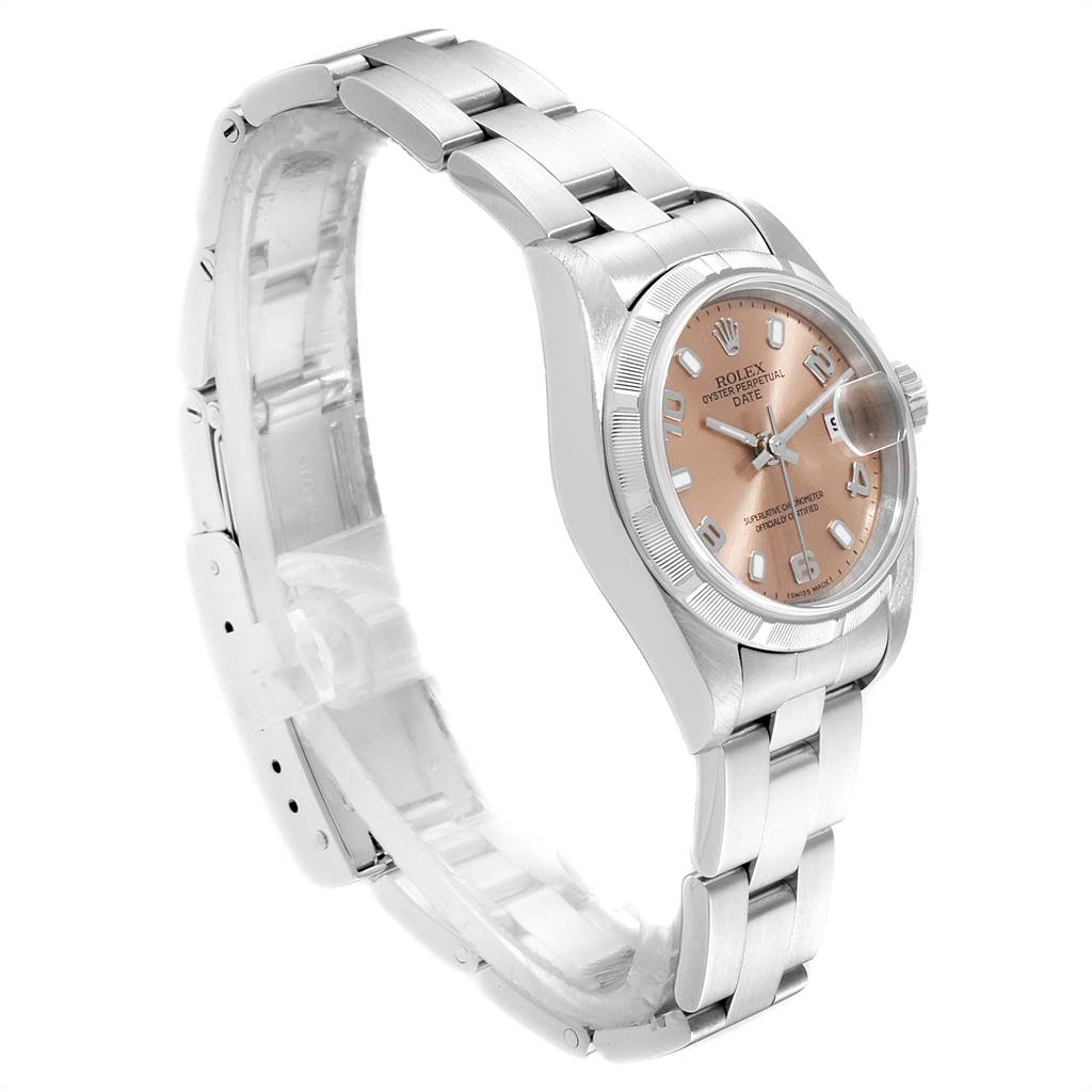 The image shows a Rolex Date 79190 Women
s Stainless Steel Pink Dial 79190 Women
s Stainless Steel Pink Dial model watch at a three-quarter view, highlighting the dial, bezel, case, and bracelet.