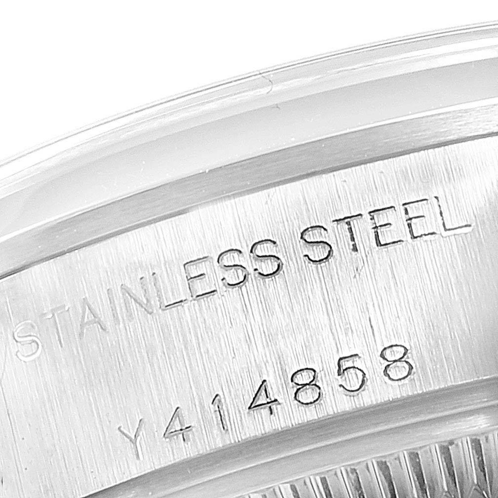 This image shows the serial number and 'STAINLESS STEEL' engraving on the case back of a Rolex Date 79160 Women's Stainless Steel White Dial 79160 Women's Stainless Steel White Dial model watch.