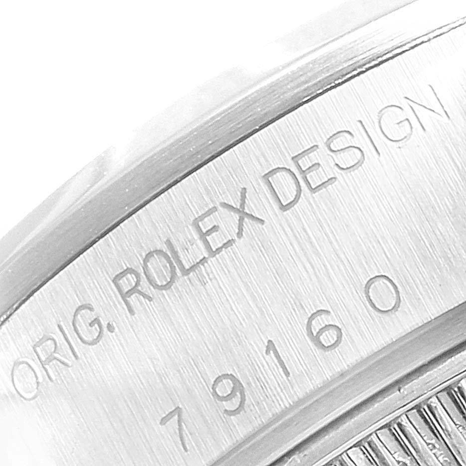 This close-up image of a Rolex Date 79160 Women's Stainless Steel White Dial 79160 Women's Stainless Steel White Dial model shows the case with the engraved serial and design details.