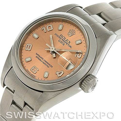 This image shows a Rolex Date 79160 Women's Stainless Steel Pink Dial 79160 Women's Stainless Steel Pink Dial model watch at an angle highlighting the case, crown, and dial with a partial view of the bracelet.