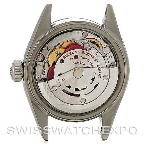 This image shows the back view of a Rolex Date 79160 Women's Stainless Steel Pink Dial 79160 Women's Stainless Steel Pink Dial model without the case back, revealing its internal mechanical movement.