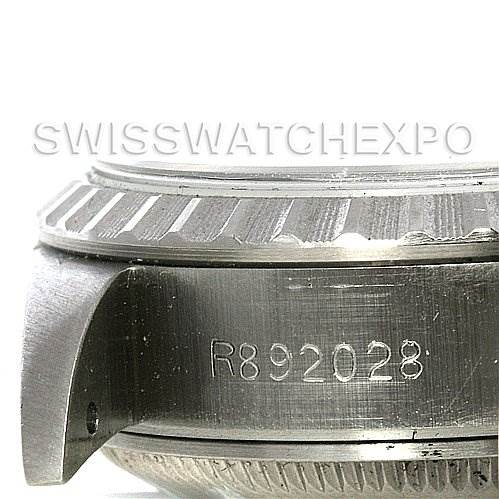 The image shows a close-up side view of the casing and bezel of a Rolex Date 69240 Women's Stainless Steel Grey Dial 69240 Women's Stainless Steel Grey Dial model watch, displaying its serial number.