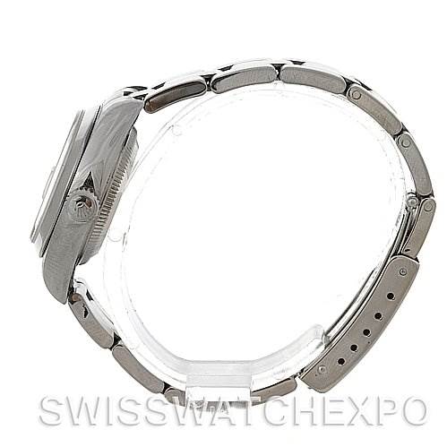 This side view of the Rolex Date 79160 Women's Stainless Steel Silver Dial 79160 Women's Stainless Steel Silver Dial model watch showcases the case, crown, and the bracelet links.