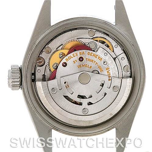 This image shows the movement mechanism from the back of a Rolex Date 79160 Women's Stainless Steel Silver Dial 79160 Women's Stainless Steel Silver Dial model watch, with visible gears and components.