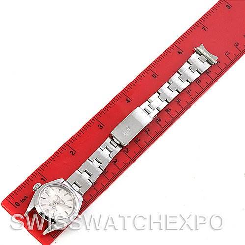 The image shows a Rolex Date 79160 Women's Stainless Steel Silver Dial 79160 Women's Stainless Steel Silver Dial model watch laid flat with its metal bracelet fully extended next to a ruler for scale.