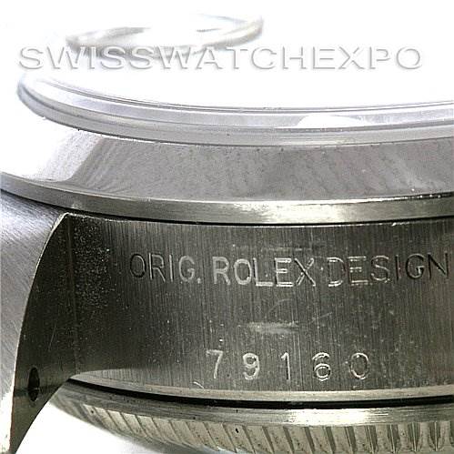 This image shows a close-up of the side of a Rolex Date 79160 Women
s Stainless Steel White Dial 79160 Women
s Stainless Steel White Dial model watch, revealing the case with engravings "Orig. Rolex Design" and "79160."